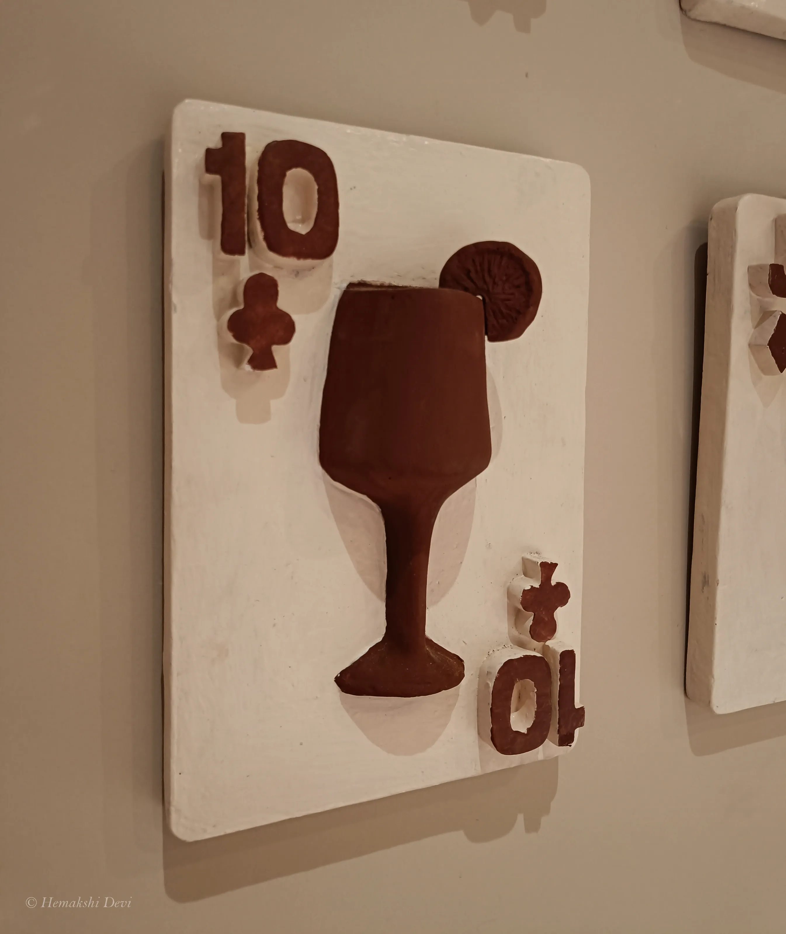 Detail of a playing-card relief on the Joha Brew bar wall